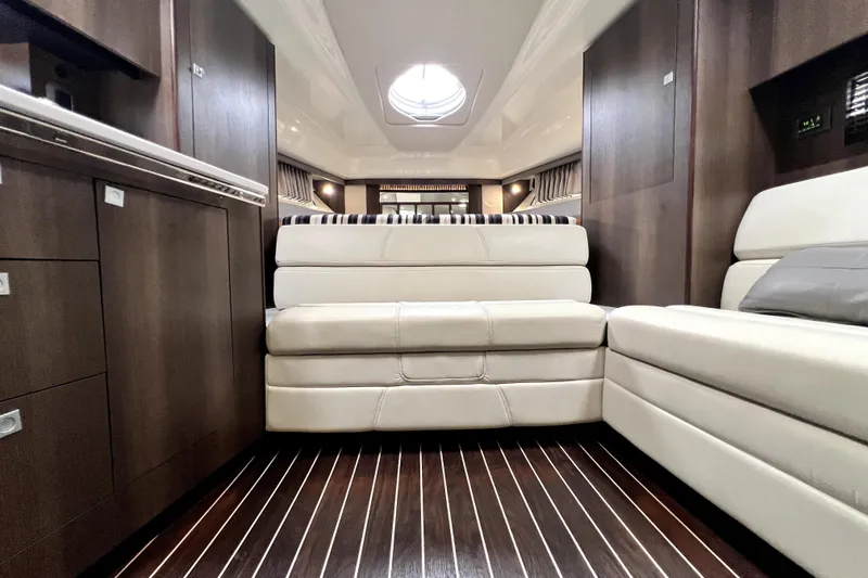 Slide: The Image of Luxurious interior of 2018 Monterey 355 Sport Yacht with elegant seating and wood flooring. - 57