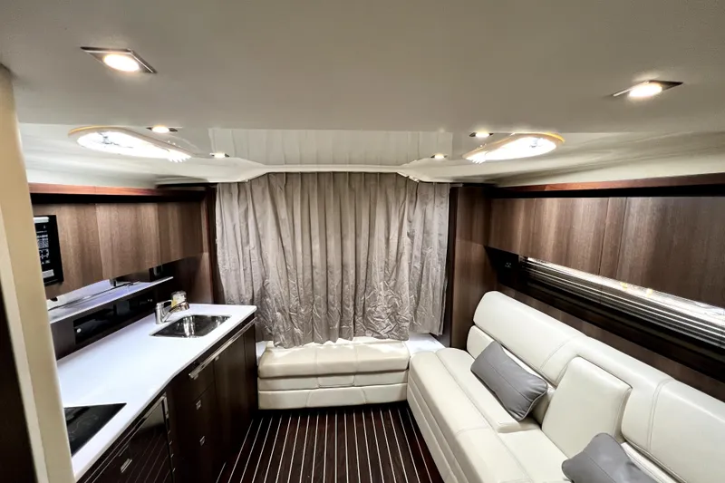 Slide: The Image of Luxurious interior of a 2018 Monterey 355 Sport Yacht with modern kitchen and seating area. - 84