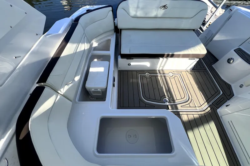 Slide: The Image of 2018 Monterey 355 Sport Yacht interior with white seating and teak-style flooring. - 110