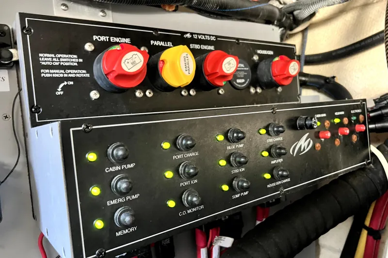Slide: The Image of Control panel of a 2018 Monterey 355 Sport Yacht, featuring engine and pump switches. - 60