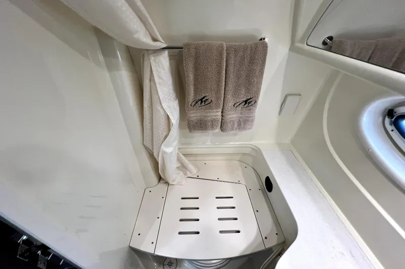 Slide: The Image of Shower area in 2018 Monterey 355 Sport Yacht with towels and curtain. - 48