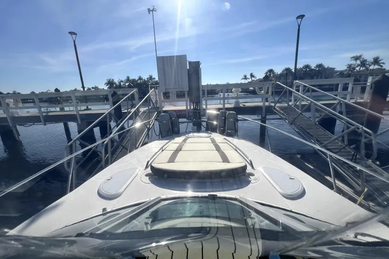 Slide: The Image of 2018 Monterey 355 Sport Yacht docked at marina under clear blue sky. - 101
