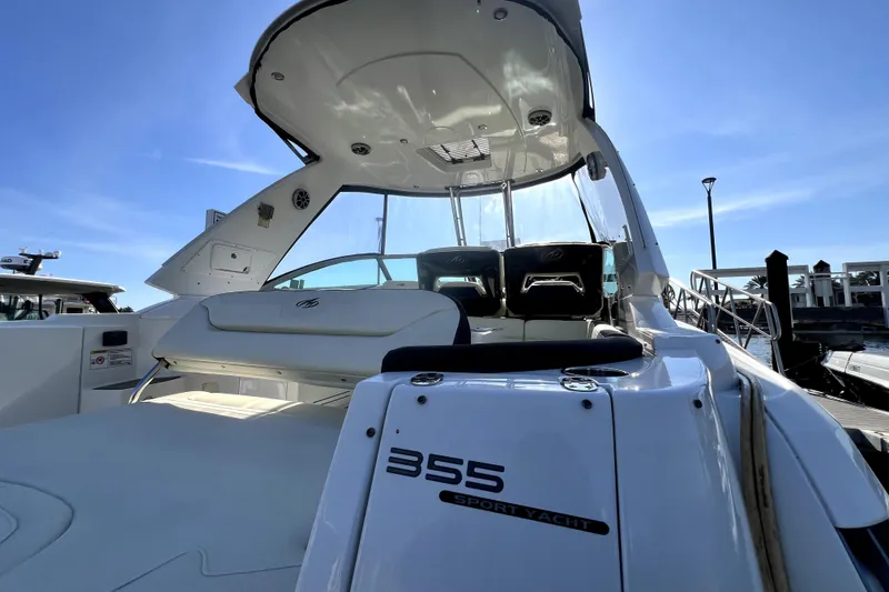 Slide: The Image of 2018 Monterey 355 Sport Yacht docked, showcasing sleek design and luxurious seating. - 32