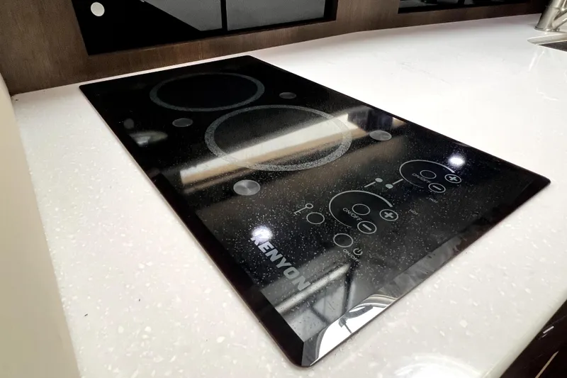 Slide: The Image of Modern induction cooktop on 2018 Monterey 355 Sport Yacht kitchen counter. - 98