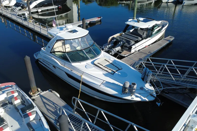 The Image of 2018 Monterey 355 Sport Yacht docked at marina, aerial view. - 0