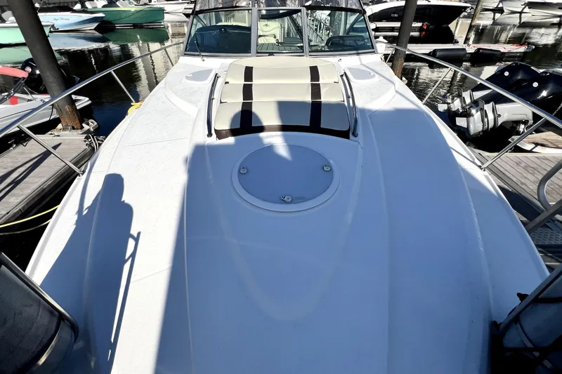 Slide: The Image of 2018 Monterey 355 Sport Yacht docked at marina, showcasing sleek deck design. - 128