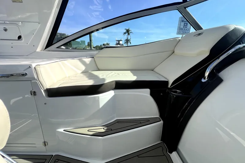 Slide: The Image of Interior of a 2018 Monterey 355 Sport Yacht with white seating and sleek design. - 105