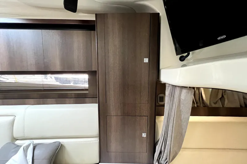 Slide: The Image of Interior of 2018 Monterey 355 Sport Yacht with wood paneling and modern furnishings. - 79
