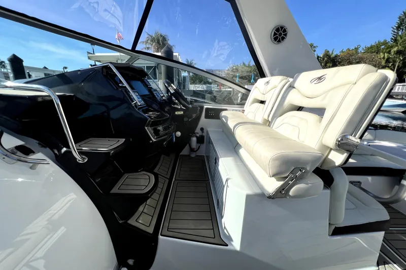 Slide: The Image of Cockpit of 2018 Monterey 355 Sport Yacht with luxurious seating and modern controls. - 124