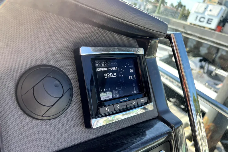 Slide: The Image of Dashboard of a 2018 Monterey 355 Sport Yacht showing engine hours at 928.3. - 63