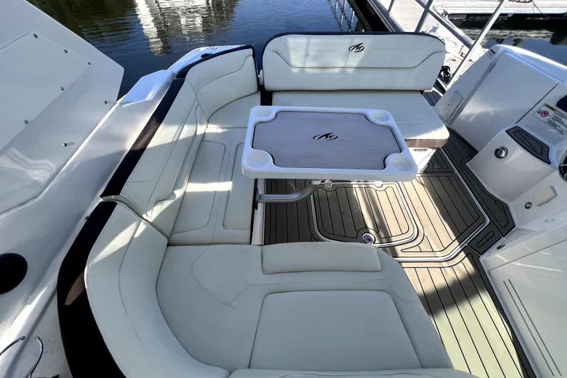 Slide: The Image of Luxurious seating area on a 2018 Monterey 355 Sport Yacht with elegant table and deck. - 106