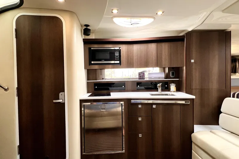 Slide: The Image of Luxurious interior of 2018 Monterey 355 Sport Yacht with modern kitchen amenities. - 100