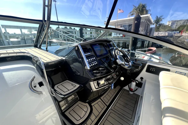 Slide: The Image of Cockpit of 2018 Monterey 355 Sport Yacht with modern controls and steering wheel. - 102