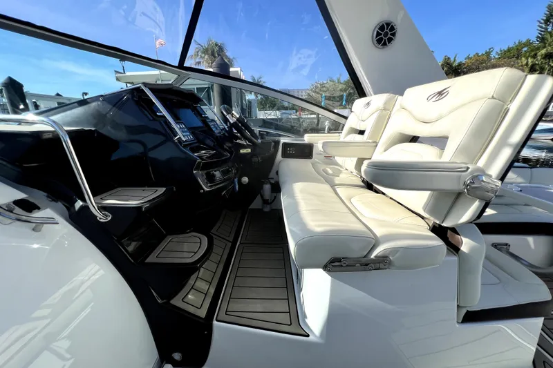 Slide: The Image of Interior of 2018 Monterey 355 Sport Yacht with luxurious seating and modern dashboard. - 126