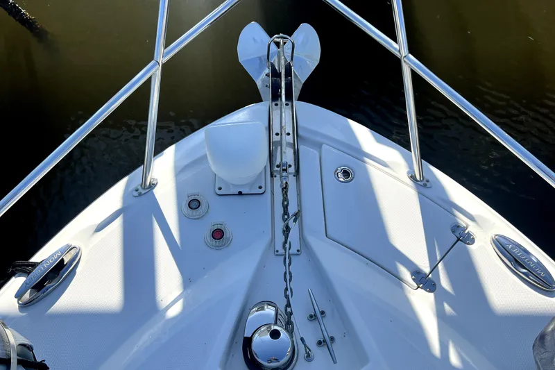 Slide: The Image of Bow view of 2018 Monterey 355 Sport Yacht with anchor and railing details. - 131