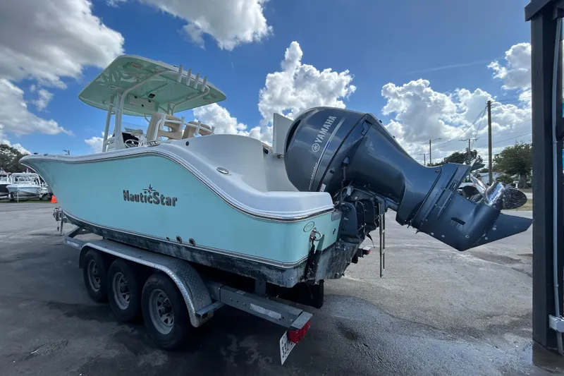 Slide: The Image of 2018 NauticStar 28 XS boat on trailer with Yamaha outboard motor. - 3