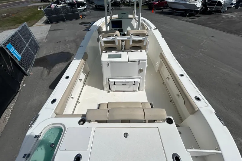 Slide: The Image of 2018 NauticStar 28 XS boat interior with seating and storage compartments. - 10