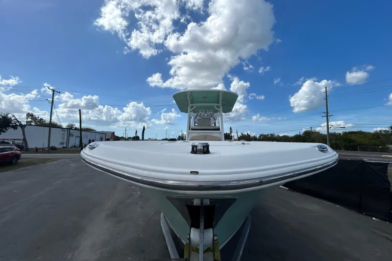 Slide: The Image of 2018 NauticStar 28 XS boat under a bright blue sky with scattered clouds. - 8