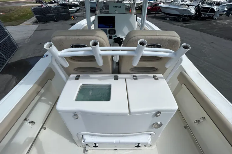 Slide: The Image of 2018 NauticStar 28 XS boat interior with rod holders and seating. - 14
