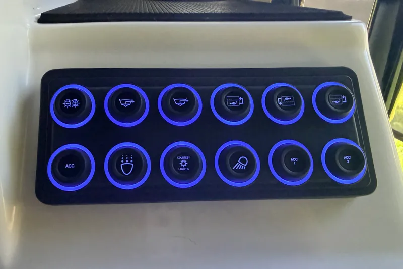 Slide: The Image of Control panel with illuminated buttons on a 2023 SCB S22 model. - 16