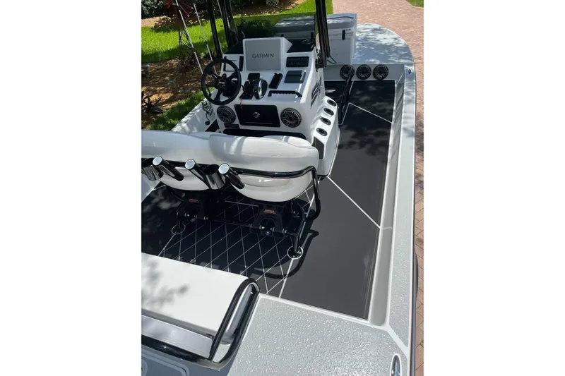 Slide: The Image of 2023 SCB S22 boat interior with Garmin navigation, sleek seating, and modern controls. - 4
