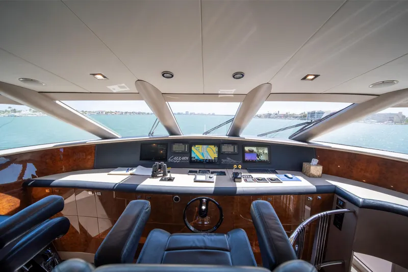 Slide: The Image of Luxurious 2001 Lazzara 94 yacht helm with modern navigation equipment and panoramic sea view. - 18