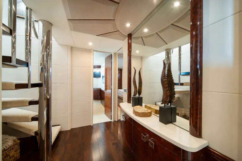 Slide: The Image of Luxurious interior of 2001 Lazzara 94 yacht with elegant decor and spiral staircase. - 20