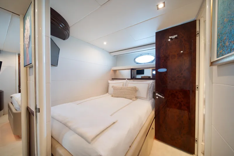 Slide: The Image of Luxurious bedroom interior of a 2001 Lazzara 94 yacht with elegant decor. - 26