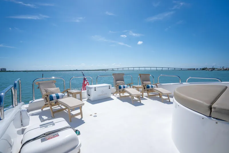 Slide: The Image of Luxurious deck of 2001 Lazzara 94 yacht with sun loungers and ocean view. - 35