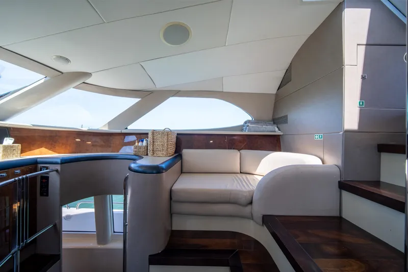 Slide: The Image of Luxurious interior of a 2001 Lazzara 94 yacht with elegant seating and wooden accents. - 19