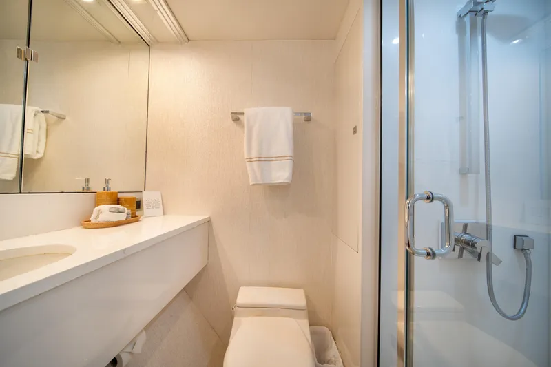 Slide: The Image of Luxurious bathroom in 2001 Lazzara 94 yacht with modern fixtures and elegant design. - 32