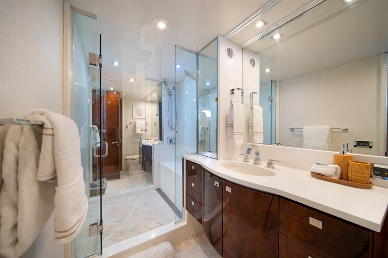 Slide: The Image of Luxurious bathroom on 2001 Lazzara 94 yacht, featuring elegant fixtures and modern design. - 25
