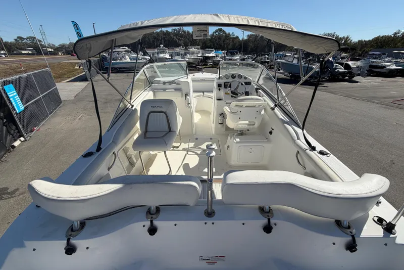 Slide: The Image of 2008 Sea Fox 216 Dual Console boat with canopy, docked in a marina. - 14