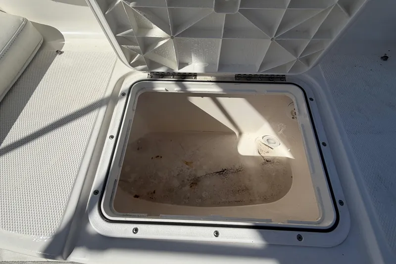 Slide: The Image of Open storage compartment on a 2008 Sea Fox 216 Dual Console boat. - 49