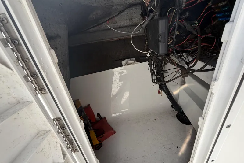 Slide: The Image of Interior view of a 2008 Sea Fox 216 Dual Console boat's storage compartment. - 33