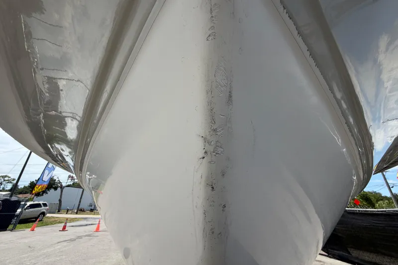 Slide: The Image of Close-up of 2008 Sea Fox 216 Dual Console boat hull, showcasing sleek design and glossy finish. - 58