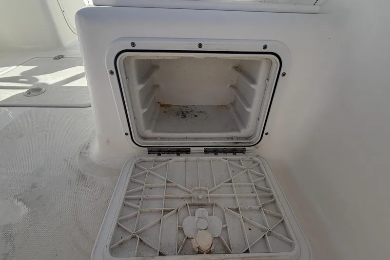 Slide: The Image of Open storage compartment on a 2008 Sea Fox 216 Dual Console boat. - 22