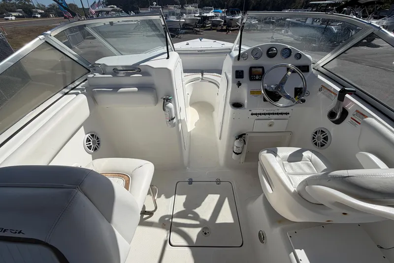 Slide: The Image of 2008 Sea Fox 216 Dual Console boat interior with steering wheel and seating. - 23