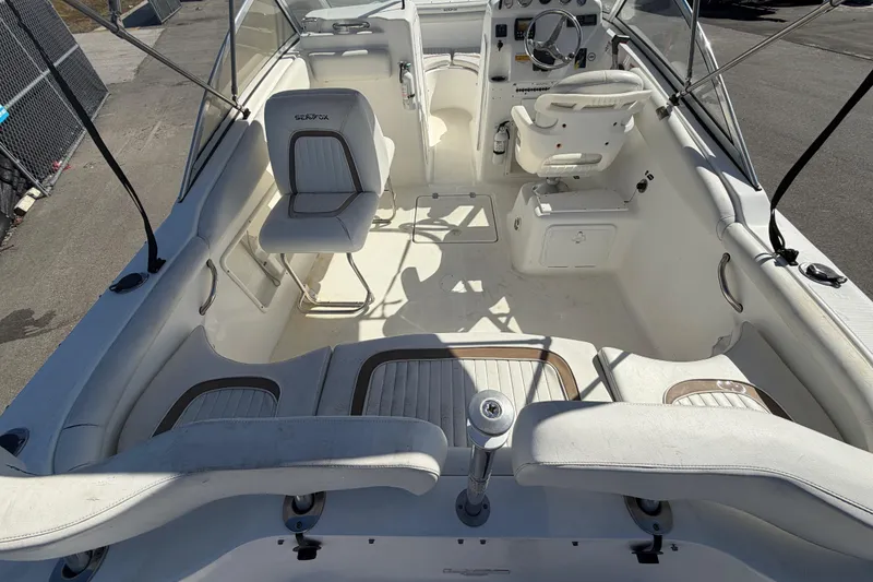 Slide: The Image of 2008 Sea Fox 216 Dual Console boat interior with seating and steering wheel. - 16