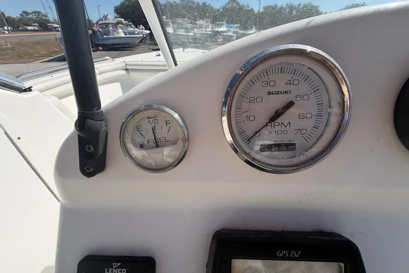 Slide: The Image of 2008 Sea Fox 216 Dual Console dashboard with fuel and RPM gauges. - 27