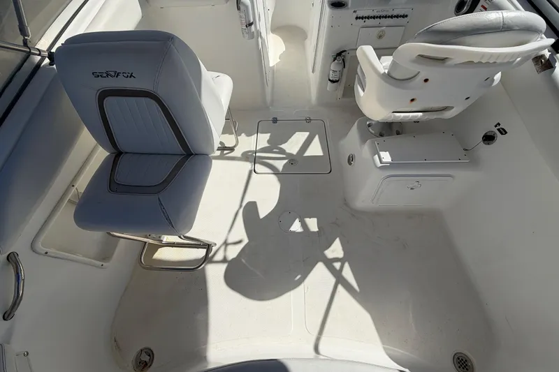 Slide: The Image of 2008 Sea Fox 216 Dual Console boat interior with seating and control panel. - 18
