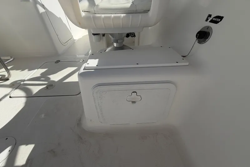 Slide: The Image of Interior of 2008 Sea Fox 216 Dual Console boat, featuring seating and storage compartments. - 21