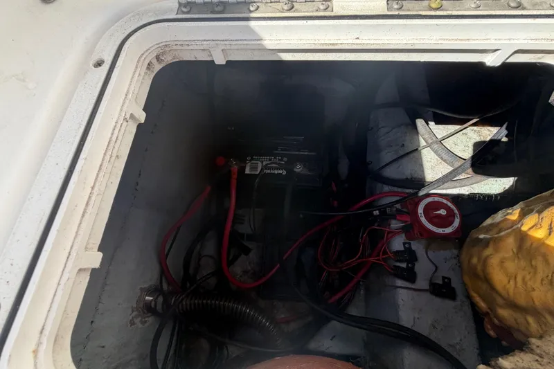 Slide: The Image of 2008 Sea Fox 216 Dual Console boat battery compartment with wiring and switch. - 47