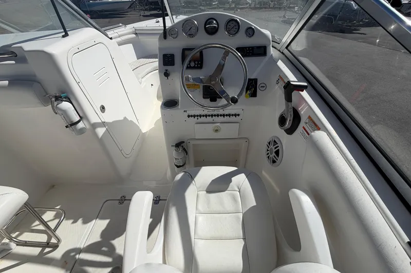 Slide: The Image of 2008 Sea Fox 216 Dual Console boat cockpit with steering wheel and controls. - 24