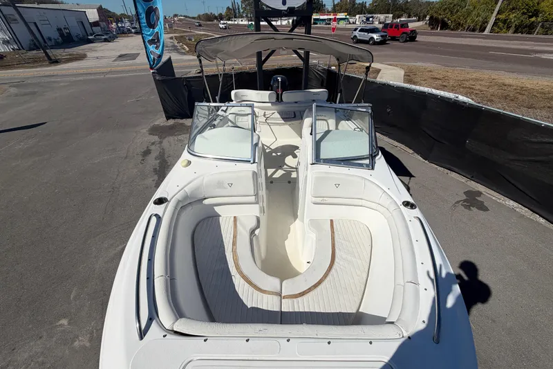 Slide: The Image of 2008 Sea Fox 216 Dual Console boat with open deck and seating, parked on pavement. - 39