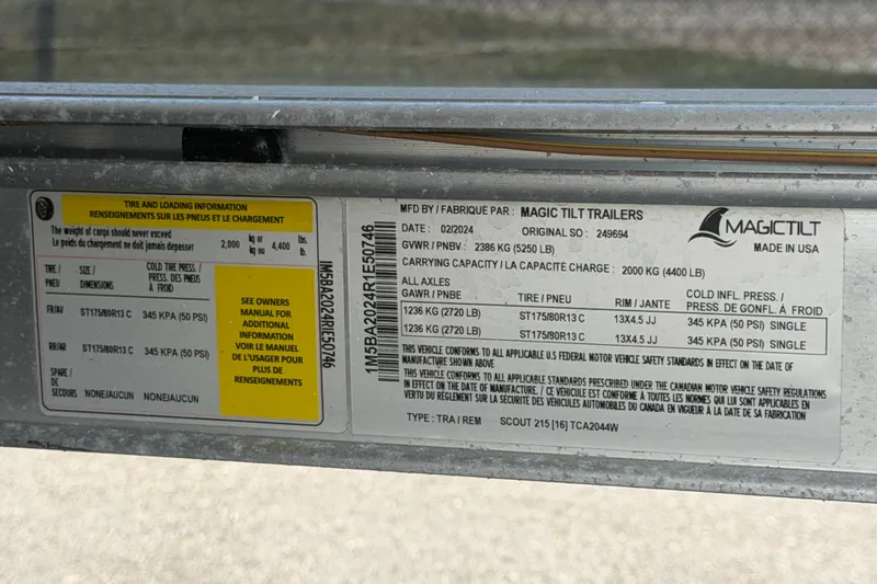 Slide: The Image of Label on Magic Tilt trailer showing tire and loading information. - 55