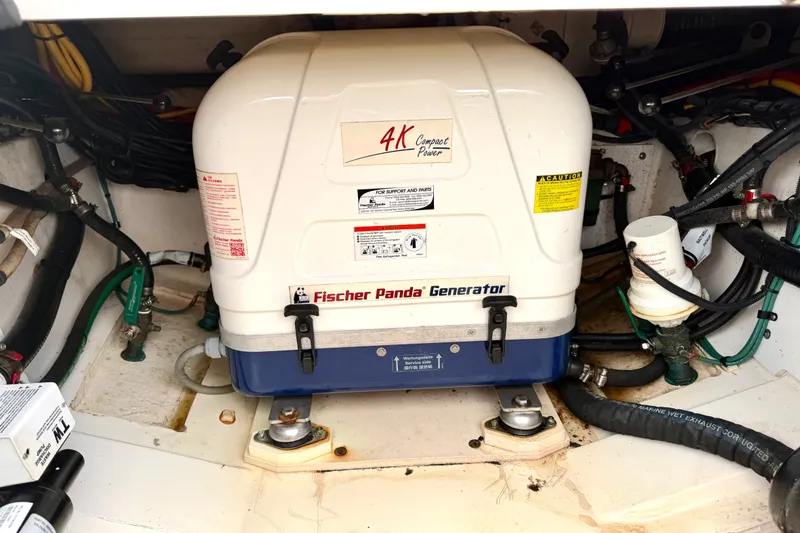 Slide: The Image of Fischer Panda generator in 2017 Pursuit DC 325 Dual Console boat engine compartment. - 24