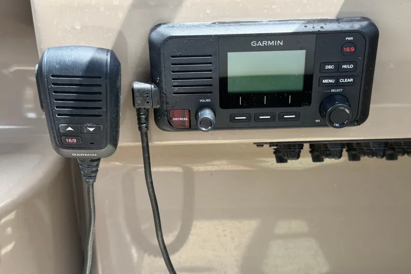 Slide: The Image of Garmin marine radio system on 2018 Regal 28 Express boat dashboard. - 42