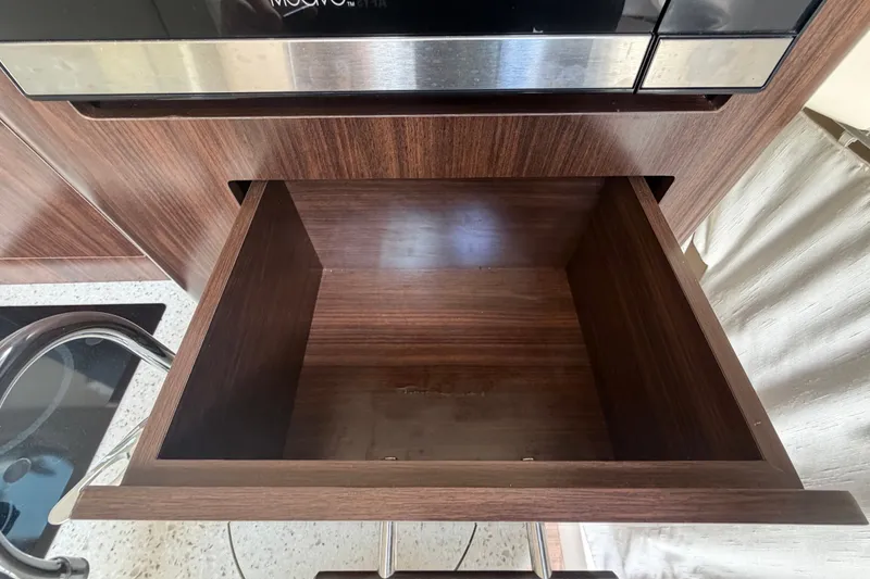 Slide: The Image of Empty wooden drawer in 2018 Regal 28 Express boat interior. - 68