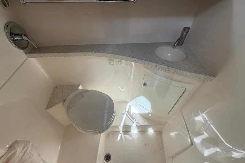 Slide: The Image of Bathroom interior of 2018 Regal 28 Express boat with sink and toilet. - 88